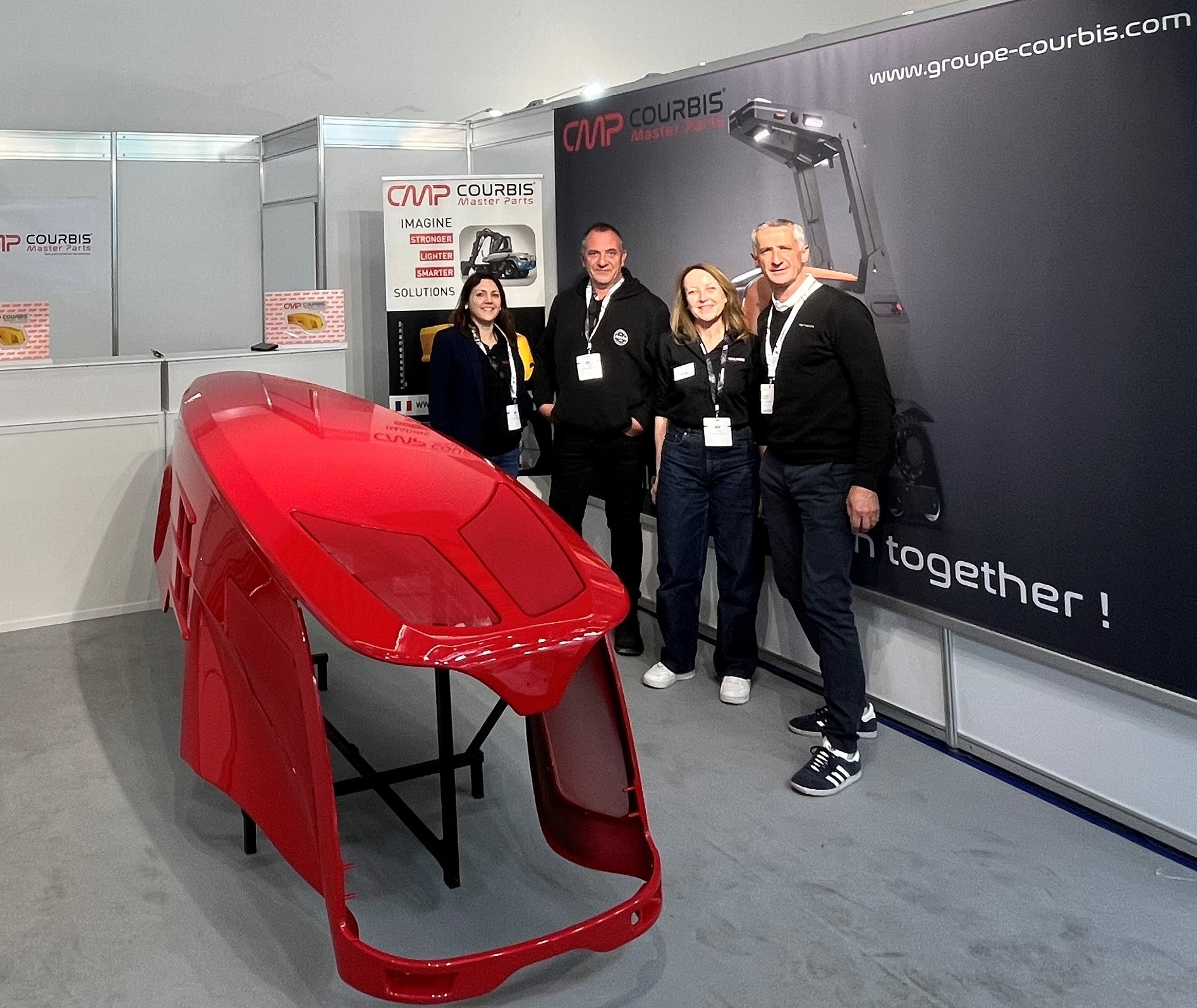 Courbis Master Parts booth at BAUMA 2025, showcasing a red PDCPD body part